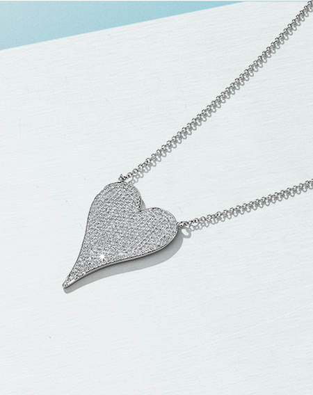 Shy Creation white gold and diamond heart pendant on a white background.